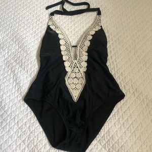 Black one piece swimsuit with crochet detailing